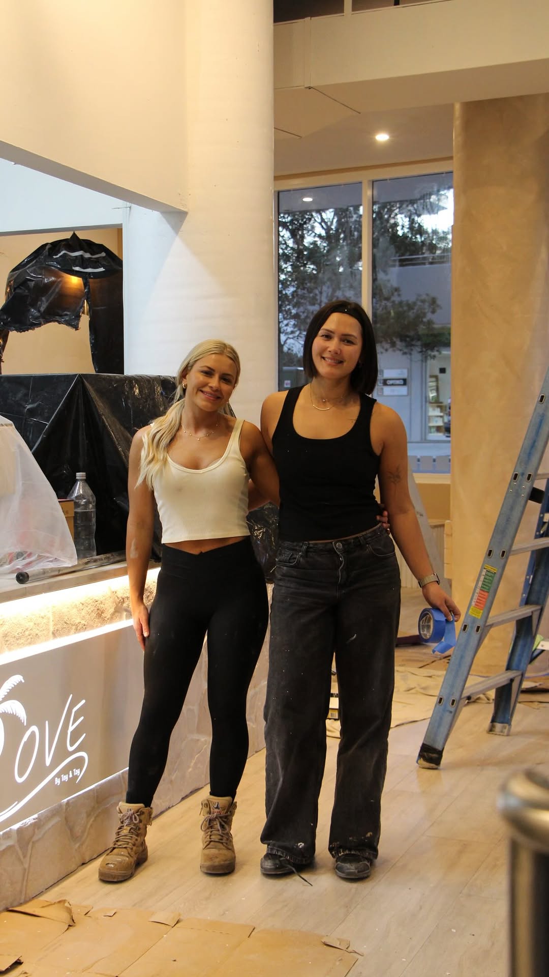 Taya and Tayla together while creating the COVE cafe space
